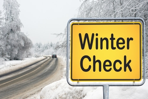 Don’t Let Winter Catch You: Signs Your Brakes Need Service in Grand Junction, CO, with Barney Brothers Off Road & Repair. Image or a winter season road with winter check signage.