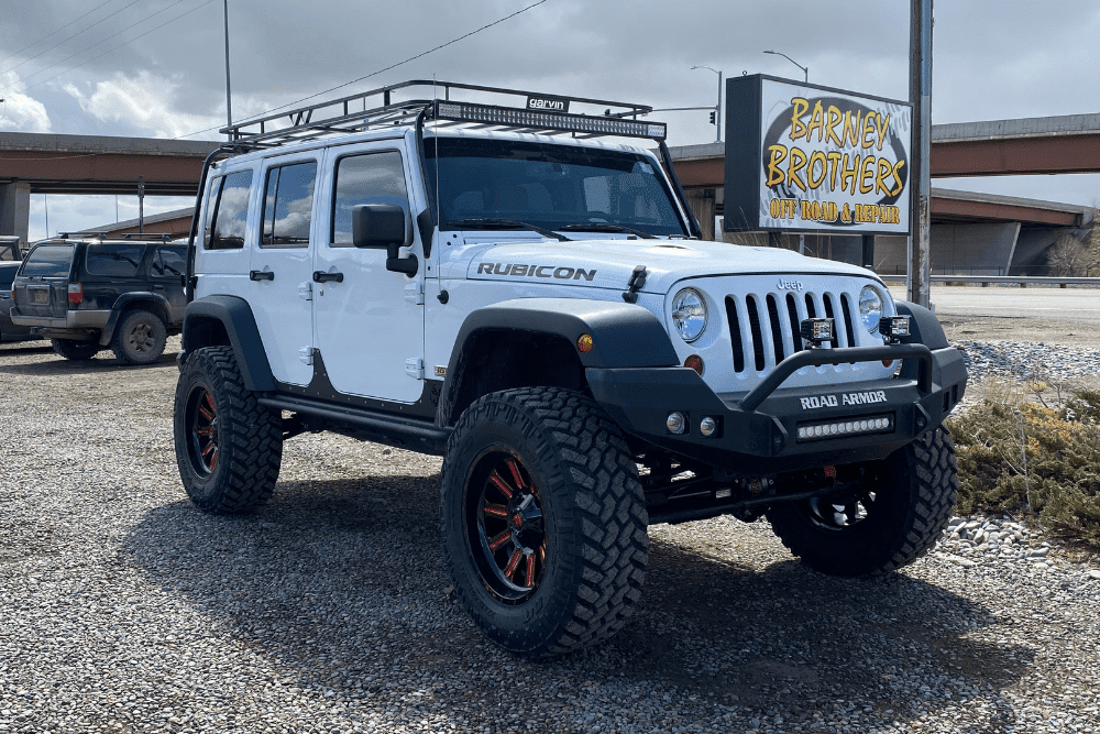 Jeep off-road upgrades, Off-Road and Repair in Grand Junction, CO at Barney Brothers Off-Road and Repair. Lifted Jeep Wrangler Rubicon parked in front of Barney Brothers Off Road & Repair